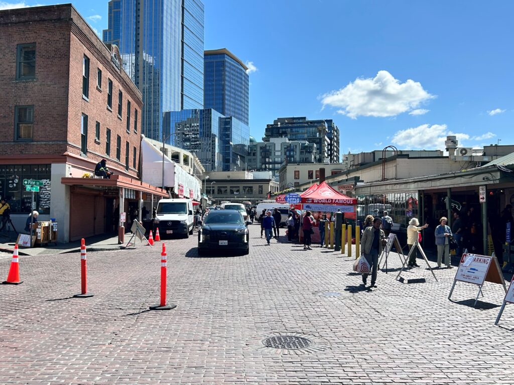 Concrete vehicle barriers arrive at Pike Place Market ahead of World Cup